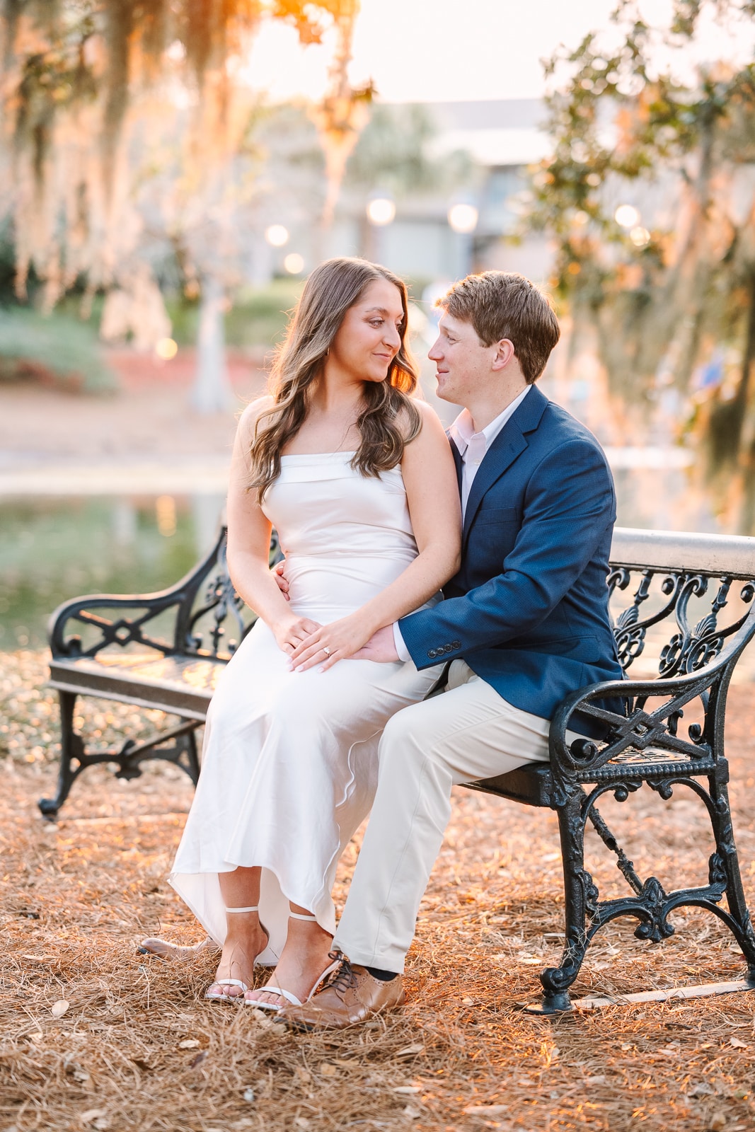 Bride sits on Grooms lap for engagement photos in Fairhope Al