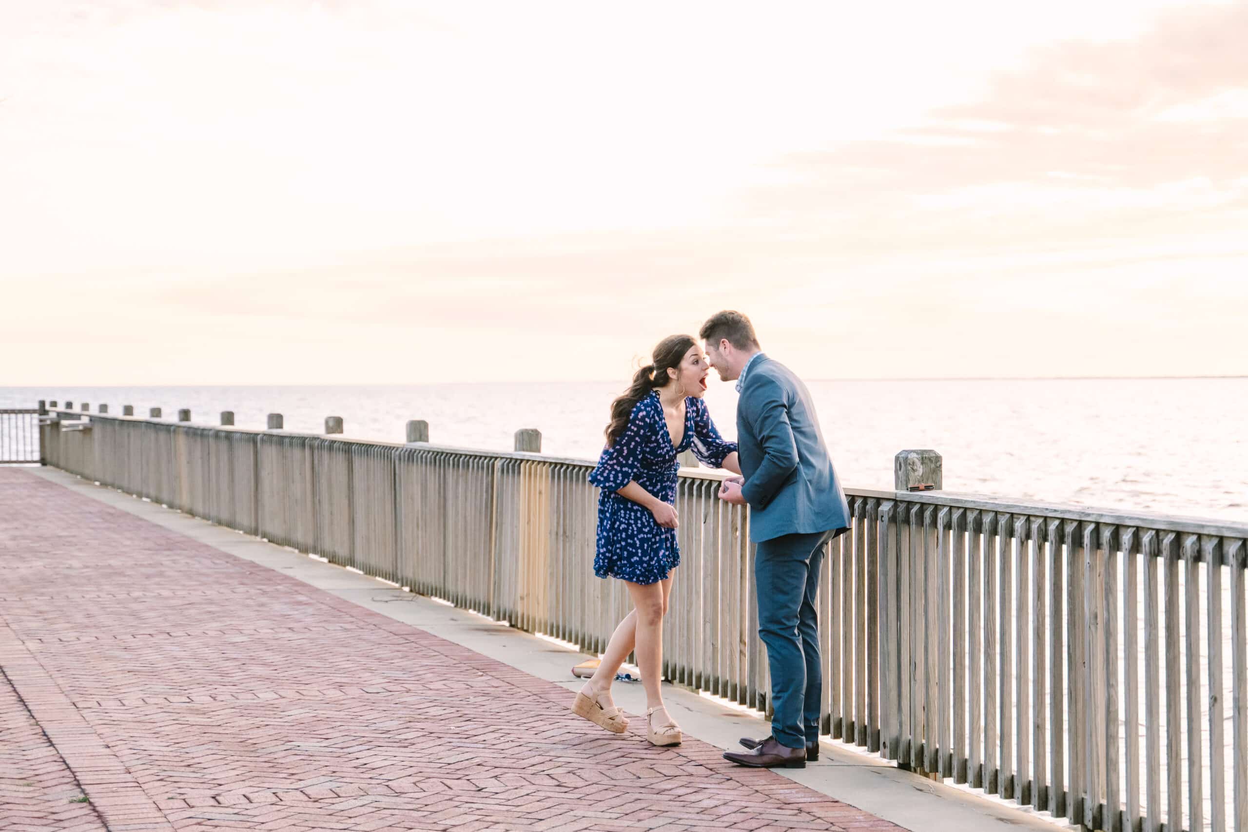 couple on boardwalk about to get engaged